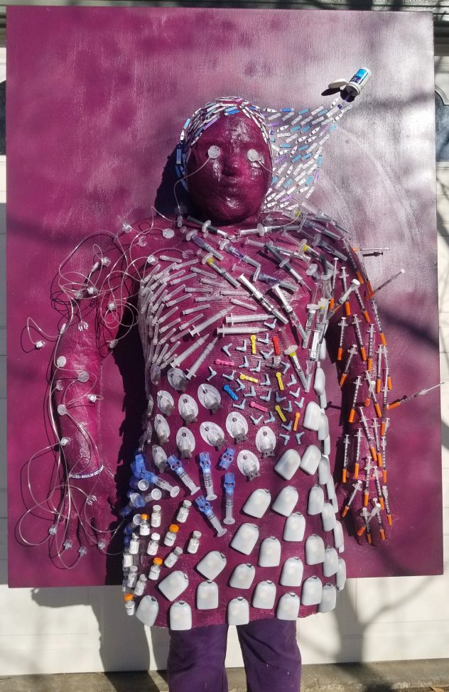 Over the summer I decided that I wanted to take on a big project because to me, a big project meant a big impact. Once again had a lot of my own used supplies but this time I also got supplies from others to show a full spectrum of supplies. I wanted this piece to stand out but also be personalized so naturally I thought the best way to do that was to make a life-sized cast of my body. I covered it to show how diabetes surrounds you 24/7 whether you want it to or not. You may think it’s random or overwhelming but sometimes I feel that way about diabetes.