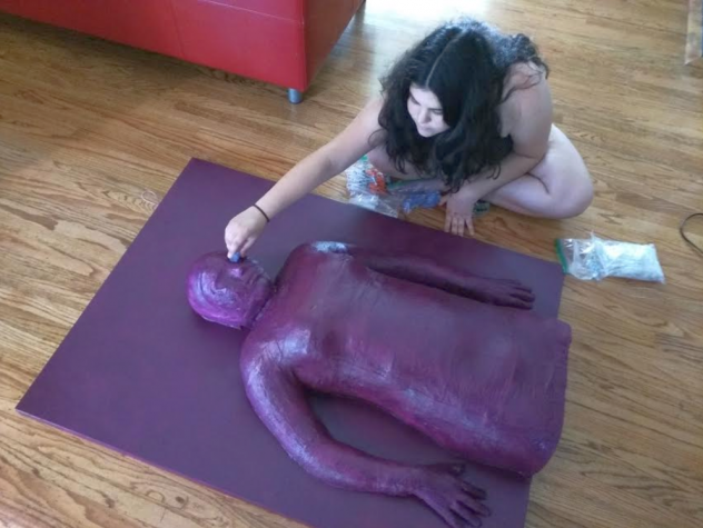 Shiraz glueing used diabtes supplies to the painting.